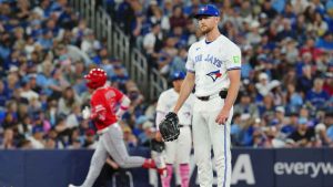 Toronto Blue Jays pitcher Eric Lauer looks on as Los Angeles Angels second baseman Oswald Peraza (2) rounds the bases after hitting a two run home run during the top of the fifth inning MLB baseball action. (Frank Gunn/THE CANADIAN PRESS)
