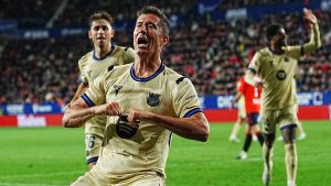 Barcelona's Robert Lewandowski celebrates after scoring his side's opening goal during a Spanish La Liga soccer match between Osasuna and Barcelona in Pamplona, Spain, Saturday, May 2, 2026. (Miguel Oses/AP)
