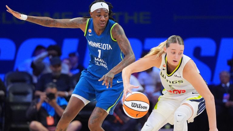 Dallas Wings guard Paige Bueckers, right, is defended by Minnesota Lynx forward Natasha Howard (1) during the second half of a WNBA basketball game in Arlington, Texas, Thursday, May 14, 2026. (LM Otero/AP)