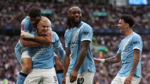 Manchester City's Antoine Semenyo, center, celebrates with teammates after scoring the opening goal during the English FA Cup final soccer match between Chelsea and Manchester City. (Richard Pelham/AP)