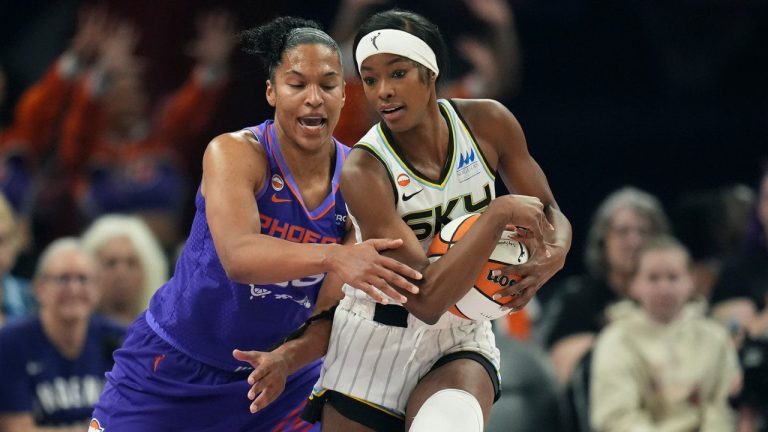 Chicago Sky forward Rickea Jackson, right, keeps the ball away from Phoenix Mercury forward Alyssa Thomas during the first half of a WNBA basketball game, Friday, May 15, 2026, in Phoenix. (Ross D. Franklin/AP)