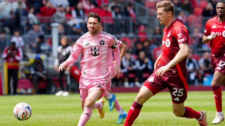 Inter Miami CF midfielder Lionel Messi (10) and Toronto FC defender Walker Zimmerman (25) chase the ball during first half MLS soccer in Toronto on Saturday, May 9, 2026. (Frank Gunn/CP)