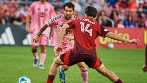 Inter Miami's Lionel Messi (10) moves the ball as Toronto FC's Alonso Coello (14) defends during second half MLS action in Toronto, on Saturday, Sept. 27, 2025. (Sammy Kogan/CP)