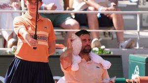Novak Djokovic of Serbia cools himself with the ice during a break of the second round men's singles tennis match against Valentin Royer of France at the French Open tennis tournament in Paris, Wednesday, May 27, 2026. (Thibault Camus/AP)