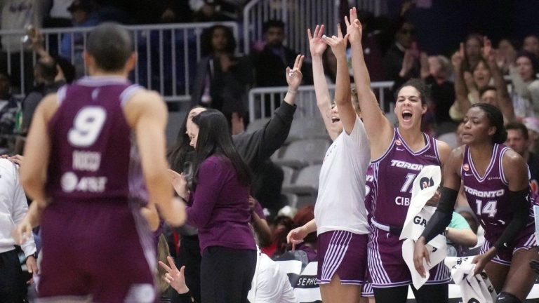 Toronto Tempo guard Kia Nurse (11) cheers from the bench after her teammate made a basket against the Connecticut Sun during first half pre-season WNBA basketball action in Toronto on Wednesday, April 29, 2026. (Nathan Denette/CP)