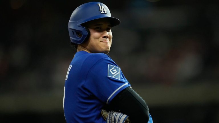 Los Angeles Dodgers designated hitter Shohei Ohtani stands on third base during the fifth inning of a baseball game against the Houston Astros in Houston, Monday, May 4, 2026. (Ashley Landis/AP)