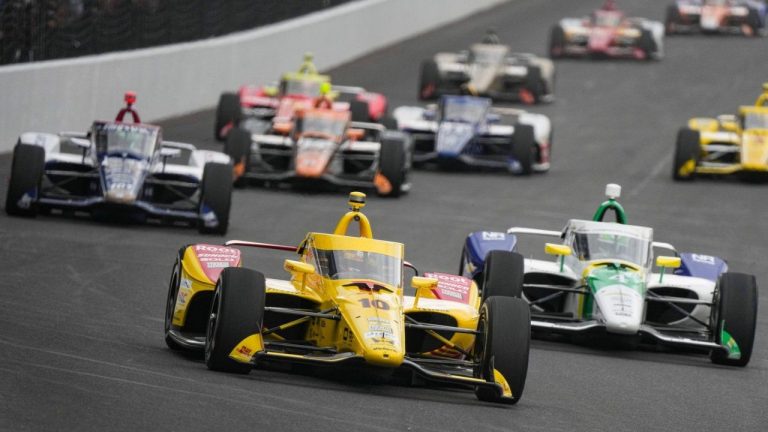 Alex Palou (10), of Spain, leads the field into the first turn during the Indianapolis 500 auto race at Indianapolis Motor Speedway in Indianapolis, Sunday, May 24, 2026. (Michael Conroy/AP)