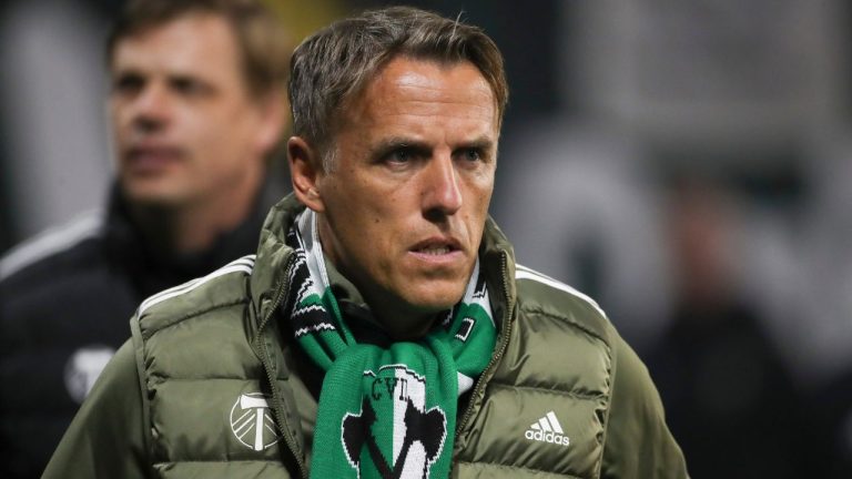 Portland Timbers head coach Phil Neville walks onto the field before an MLS soccer match against the Colorado Rapids, Saturday, Feb. 24, 2024, in Portland, Ore. (Amanda Loman/AP)