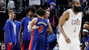 Detroit Pistons guard Cade Cunningham (2) is hugged by Duncan Robinson as Kevin Huerter, left, and Tolu Smith wait late in the fourth quarter of a loss to the Cleveland Cavaliers during Game 7 in a second-round NBA basketball playoffs series Sunday, May 17, 2026, in Detroit. (Duane Burleson/AP)