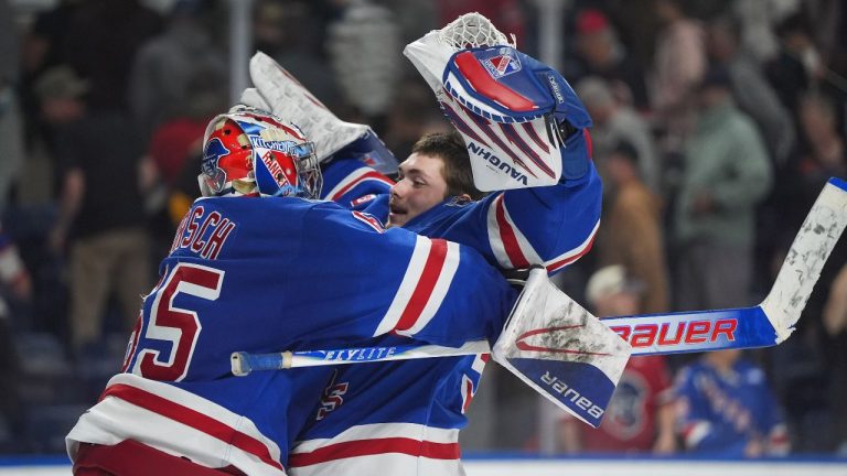 Kitchener Rangers goalie Christian Kirsch, left, and goalie Jason Schaubel celebrate after Kitchener defeated the Chicoutimi Sagueneens 3-2 during a Memorial Cup hockey game, in Kelowna, B.C., on Tuesday, May 26, 2026. (Darryl Dyck/THE CANADIAN PRESS)