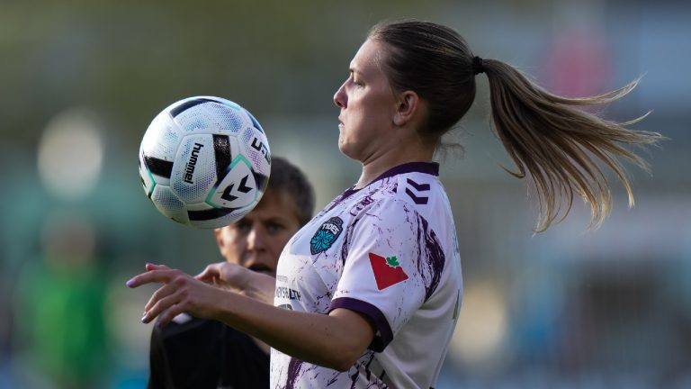 Halifax Tides' Saorla Miller, front left, controls the ball while being watched by Vancouver Rise's Quinn during the first half of an NSL soccer match, in Burnaby, B.C., on Monday, May 5, 2025. (Darryl Dyck/CP)