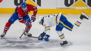 Buffalo Sabres' Tage Thompson (72) is tripped up as he battles for the puck against Montreal Canadiens' Josh Anderson (17) during first period second round, Game 3, NHL playoff action in Montreal on Sunday, May 10, 2026. (Christinne Muschi/THE CANADIAN PRESS)