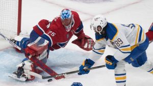 Montreal Canadiens goaltender Jakub Dobes (75) makes a save against Buffalo Sabres' Alex Tuch (89) during second period second round, Game 6, NHL playoff action in Montreal on Saturday, May 16, 2026. (Christinne Muschi/CP)