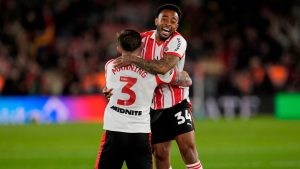 Southampton's Welington, right, and Ryan Manning celebrate at the final whistle in the EFL Championship play off semifinal soccer game between Southampton and Middlesbrough, Tuesday, May 12, 2026, in, Southampton, England. (Andrew Matthews/PA via AP)