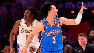 Oklahoma City Thunder guard Jared McCain, right, gestures after scoring as Los Angeles Lakers forward Adou Thiero runs behind during the first half of Game 3 in a second-round NBA basketball playoffs series Saturday, May 9, 2026, in Los Angeles. (Mark J. Terrill/AP Photo)
