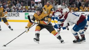 Vegas Golden Knights right wing Mitch Marner (93) skates with the puck as Colorado Avalanche center Parker Kelly (17) defends during the second period in Game 4 of the Western Conference finals NHL hockey Stanley Cup playoff series Tuesday, May 26, 2026, in Las Vegas. (John Locher/AP Photo)