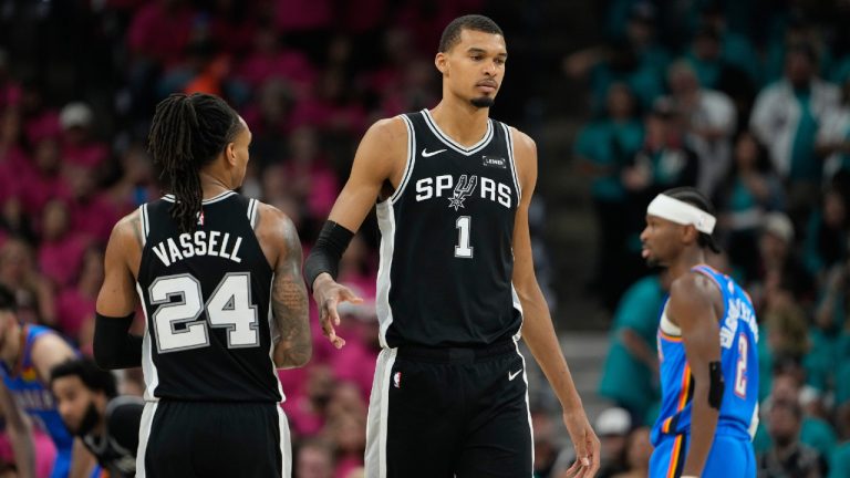 San Antonio Spurs guard Devin Vassell (24) and forward Victor Wembanyama (1) stand on the court during the second half of Game 3 in the Western Conference finals NBA basketball playoffs series against the Oklahoma City Thunder Friday, May 22, 2026, in San Antonio. (Ashley Landis/AP)