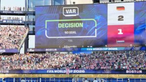 The screen shows that a goal by Germany's Jonathan Tah (4) was disqualified after a VAR check during the World Cup round of 32 soccer match between Germany and Paraguay in Foxborough, Mass., near Boston, Monday, June 29, 2026. (AP Photo/Martin Meissner)