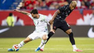 Canada's Derek Cornelius (13) and Republic of Ireland's Kevin O'Toole (7) vie for possession during first half International friendly soccer action in Montreal on June 5, 2026. (Christopher Katsarov/CP)