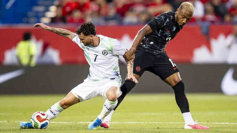Canada's Derek Cornelius (13) and Republic of Ireland's Kevin O'Toole (7) vie for possession during first half International friendly soccer action in Montreal on June 5, 2026. (Christopher Katsarov/CP)