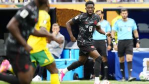 Canada's Alphonso Davies (19) runs with the ball against South Africa during second half World Cup Round of 32 soccer, in Los Angeles, on Sunday, June 28, 2026. THE CANADIAN PRESS/Frank Gunn