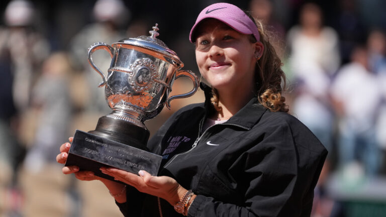 Russia's Mirra Andreeva holds the trophy after winning the final tennis match against Poland's Maja Chwalinska at the French Open in Paris, Saturday, June 6, 2026. (Thibault Camus/AP)