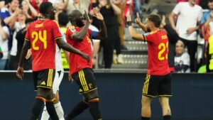 Belgium's Romelu Lukaku, second left, celebrates with teammate Belgium's Nicolas Raskin (23)after scoring his team's fourth goal during the World Cup Group G soccer match between New Zealand and Belgium in Vancouver, British Columbia, Friday, June 26, 2026. (AP Photo/Abbie Parr)