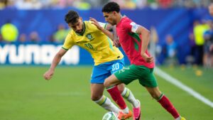 Brazil's Lucas Paqueta (20) challenges for the ball with Morocco's Achraf Hakimi (2) during the World Cup Group C soccer match between Brazil and Morocco in East Rutherford, N.J., near New York, Saturday, June 13, 2026. (Yuki Iwanmura/AP)