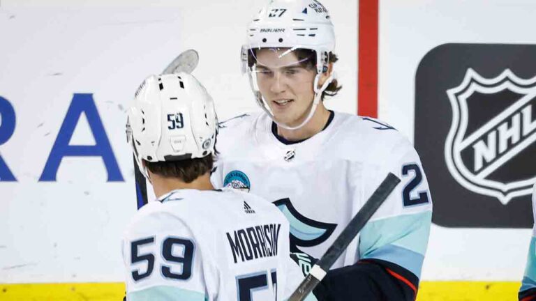 Seattle Kraken defenceman Cale Fleury, right, celebrates his goal with teammate forward Logan Morrison during first period NHL preseason hockey action against the Calgary Flames in Calgary, Monday, Sept. 25, 2023. (Jeff McIntosh/CP)