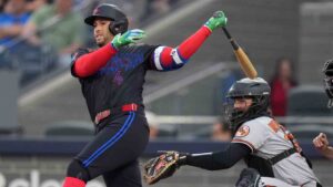 Toronto Blue Jays' George Springer (4) hits a single against the Baltimore Orioles during third inning American League, MLB baseball action in Toronto on Friday, June 5, 2026. (Nathan Denette/CP)