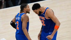 New York Knicks center Karl-Anthony Towns (32) celebrates a baked with guard Miles McBride (2) during the second half of Game 2 of the NBA Finals basketball series against the San Antonio Spurs, Friday, June 5, 2026, in San Antonio. (David J. Phillip/AP)