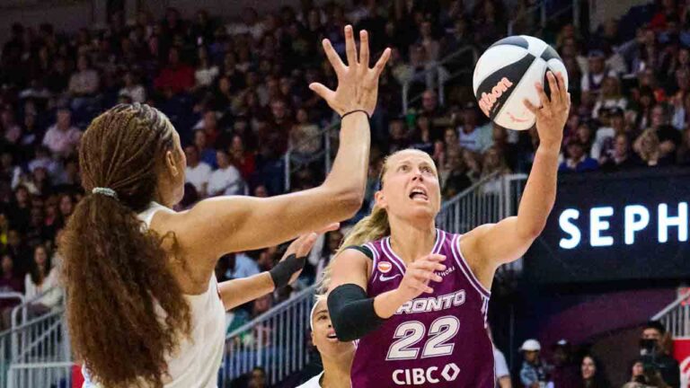 Toronto Tempo's Julie Allemand (22) drives to the net past Atlanta Dream's Naz Hillmon (00) during first half WNBA basketball action in Toronto, on Sunday, June 14, 2026. (Sammy Kogan/CP)