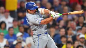 Toronto Blue Jays' Davis Schneider hits a one-run double allowing Kazuma Okamoto to score in the sixth inning of a baseball game against the Boston Red Sox, Tuesday, June 16, 2026, in Boston. (Steven Senne/AP)