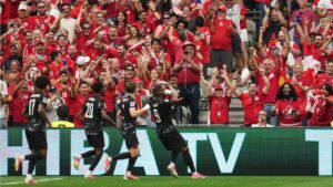 Canada's Cyle Larin, right, celebrates after scoring his side's opening goal during the World Cup Group B soccer match against Qatar in Vancouver, British Columbia, Thursday, June 18, 2026. (AP Photo/Abbie Parr)