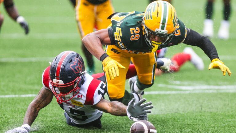 Edmonton Elks' JJ Ross (29) pounces on the ball after Montreal Alouettes' Alexander Hollins (15) loses control during second half CFL football action in Edmonton on Saturday, June 20, 2026. THE CANADIAN PRESS/Codie McLachlan