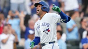 Toronto Blue Jays designated hitter George Springer (4) reacts after hitting a triple on an in-field home run after a fielding error by New York Mets' A.J. Ewing during first inning American League MLB baseball action in Toronto, Monday, June 29, 2026. (Nathan Denette/CP)