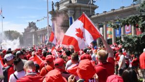 Canada's Voyageurs supporters parade toward Toronto Stadium ahead of Canada's World Cup match against Bosnia and Herzegovina. (Jon Blacker/CP)