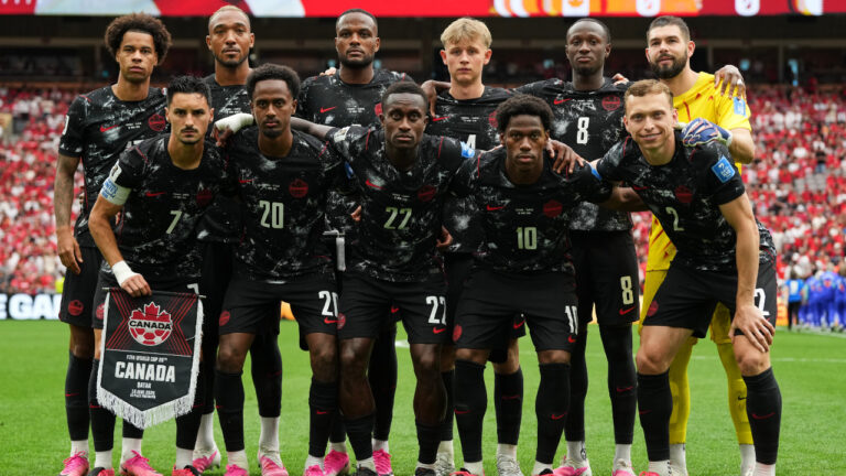 Canada's starting lineup post for a photo ahead of their match against against Qatar in Vancouver. (Abbie Parr/AP)