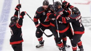 The Carolina Hurricanes players celebrate after the winning goal by Hurricanes' Seth Jarvis (24) against the Vegas Golden Knights during overtime in Game 2 of the NHL hockey Stanley Cup Final series in Raleigh, N.C., Thursday, June 4, 2026. (Ben McKeown/AP)