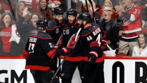 Carolina Hurricanes' Jordan Staal, second right, celebrates his goal with Carolina Hurricanes' Nikolaj Ehlers (27), K'andre Miller (19) and Jordan Martinook (48) during the second period in Game 1 of the NHL hockey Stanley Cup Final series in Raleigh, N.C., Tuesday, June 2, 2026. (Karl DeBlaker/AP)
