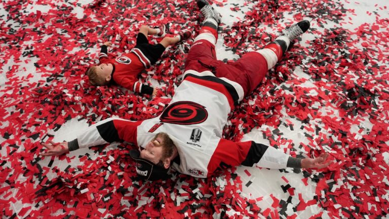 Carolina Hurricanes defenseman Jaccob Slavin (74) celebrates on the ice after a win over the Vegas Golden Knights in Game 6 of the NHL hockey Stanley Cup Final series, Sunday, June 14, 2026, in Las Vegas. (John Locher/AP)