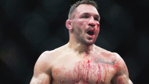 Michael Chandler is bloodied during his fight against Paddy Pimblett in a mixed martial arts fight at UFC 314, Sunday, April 13, 2025, in Miami. (AP/Lynne Sladky)