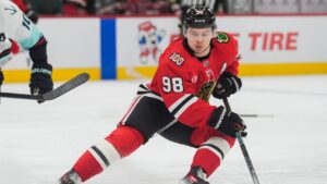 Chicago Blackhawks center Connor Bedard (98) handles the puck during the second period of an NHL hockey game against the Seattle Kraken, Thursday, Nov. 20, 2025, in Chicago. (Erin Hooley/AP)