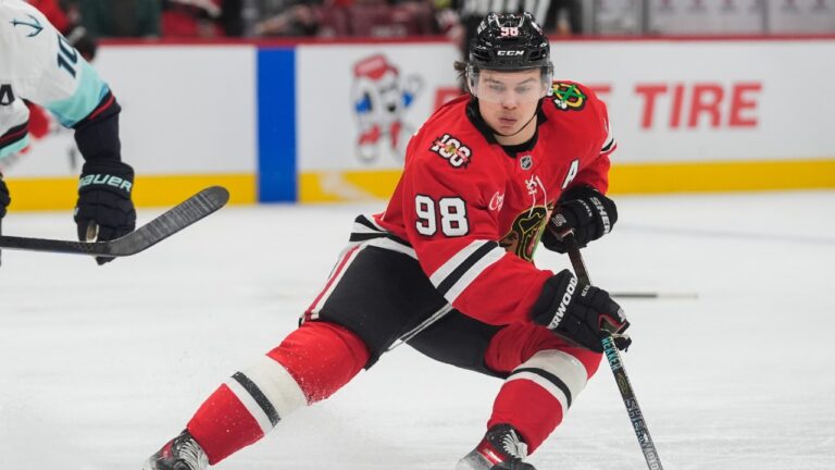Chicago Blackhawks center Connor Bedard (98) handles the puck during the second period of an NHL hockey game against the Seattle Kraken, Thursday, Nov. 20, 2025, in Chicago. (Erin Hooley/AP)