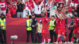 Canada's Cyle Larin (9) celebrates his goal with teammates in Group B soccer match against Bosnia-Herzegovina in Toronto. (Nathan Denette/CP)