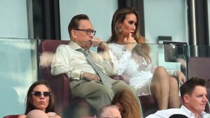 West Ham United chairman David Sullivan, left, and partner Ampika Pickston look on during the Premier League match between West Ham and Leeds United, in London, Sunday May 24, 2026. (Peter Tarry/PA via AP)