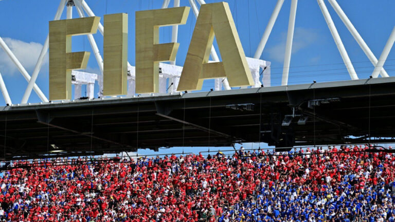 Fans of both teams cheer under a FIFA sign in the stands during group B World Cup soccer action between Canada and Bosnia and Herzegovina, in Toronto, Friday, June 12, 2026. (Sammy Kogan/CP)