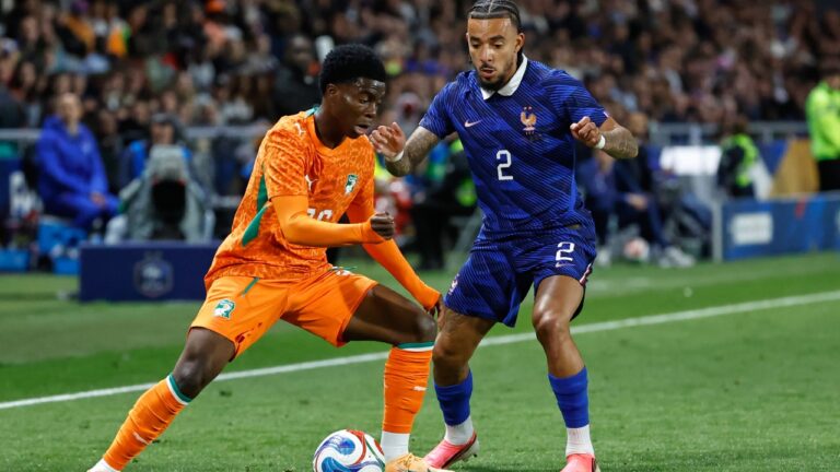 France's Malo Gusto, right, challenges for the ball with Ivory Coast's Christ Inao Oulai during the international friendly soccer match between France and Ivory Coast in Nantes, France, Thursday, June 4, 2026. (AP Photo/Jeremias Gonzalez)