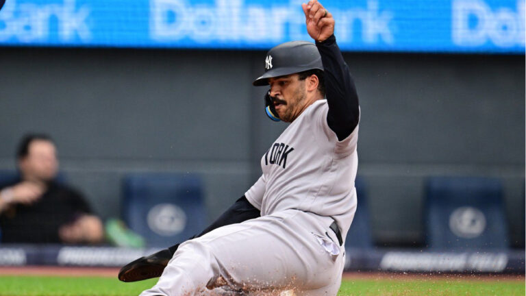 New York Yankees' Trent Grisham scores on a throwing error by Cleveland Guardians shortstop Brayan Rocchio during the third inning of a baseball game, Monday, June 8, 2026, in Cleveland. (David Dermer/AP)
