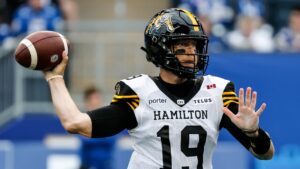 Hamilton Tiger-Cats quarterback Bo Levi Mitchell (19) throws against the Winnipeg Blue Bombers during first half CFL football action in Winnipeg on Thursday, June 11, 2026. (John Woods/CP)